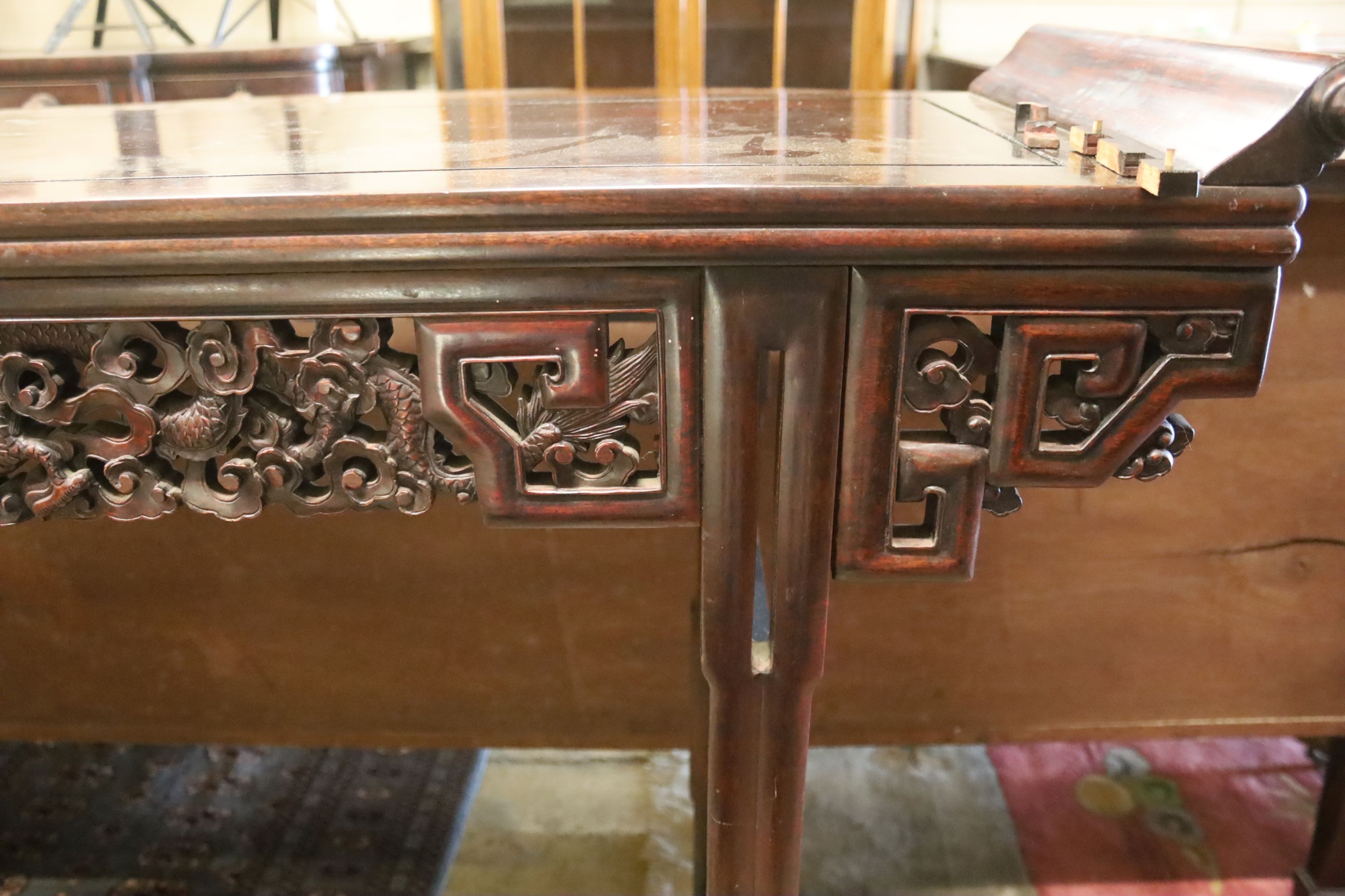 A Chinese altar table, width 150cm, depth 45cm, height 102cm